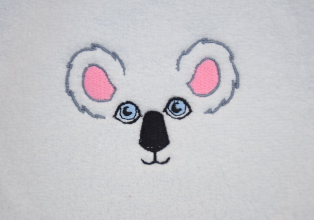 Bavoir à lacets brodé avec son motif koala